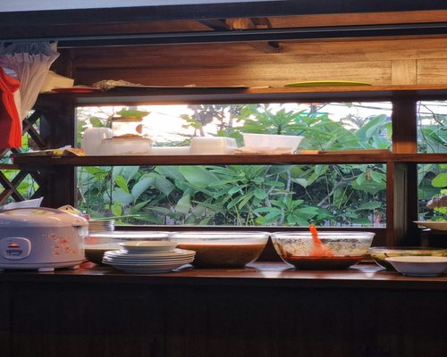 A relaxed evening view of an Indonesian home with warm lighting